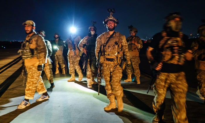 Gunfire fills the air in Kabul as Taliban celebrate airport takeover