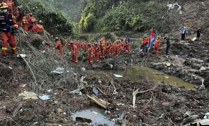 China plane crash: Wallets, ID cards, human remains found in wreckage